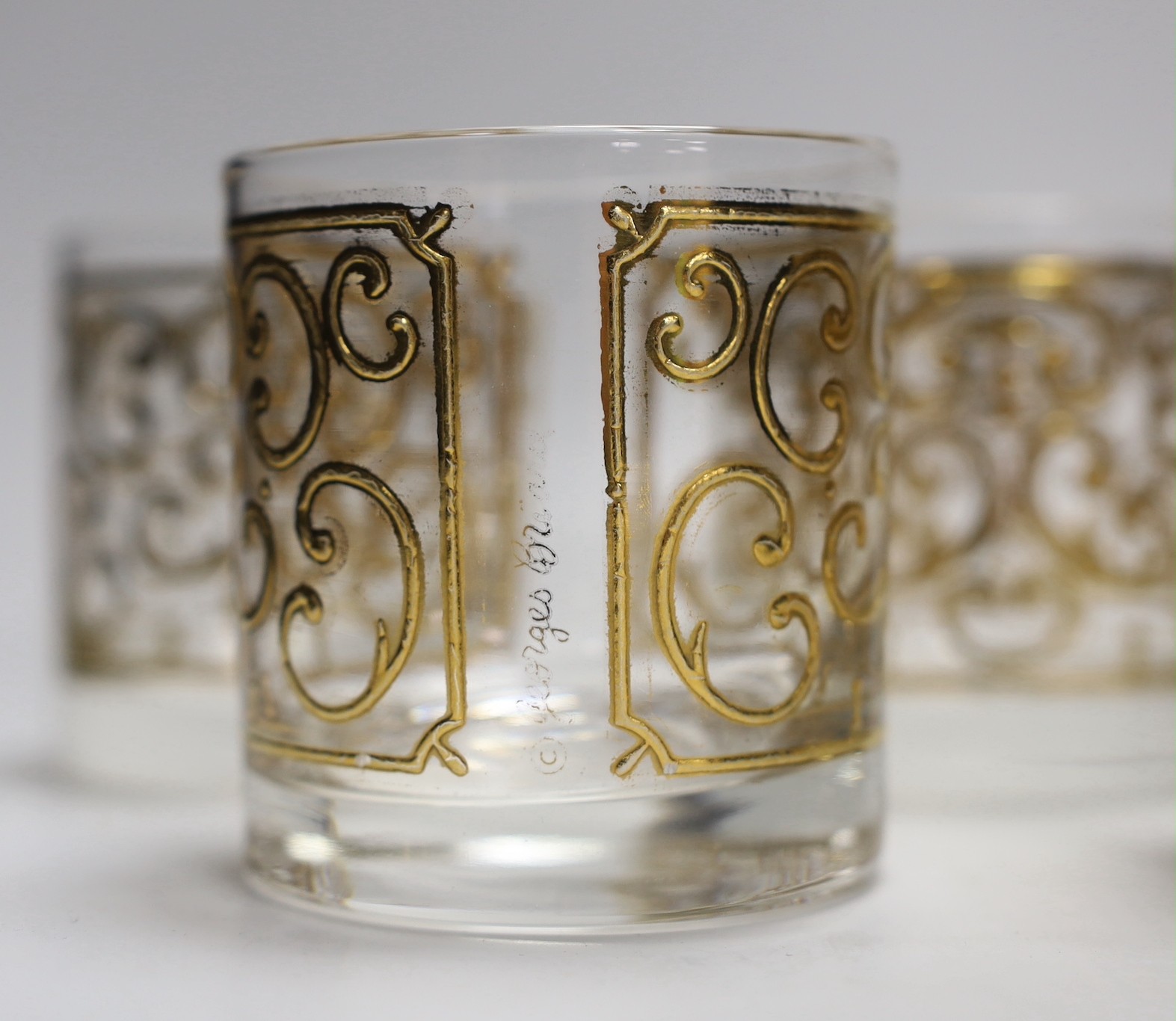 A set of seven Georges Briard gilded glass tumblers